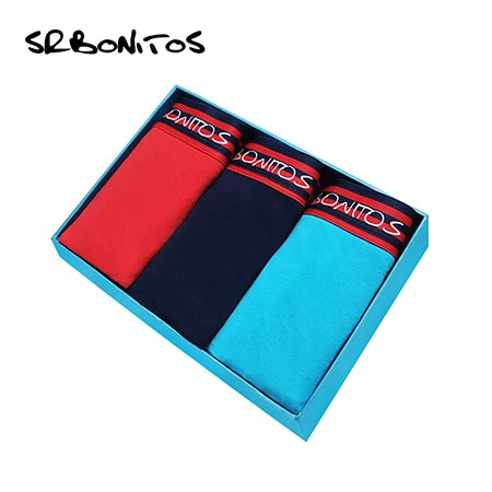 Conjunto de três cuecas sólidas masculinas da SWNITS em vermelho, azul marinho e azul claro com faixa elástica
