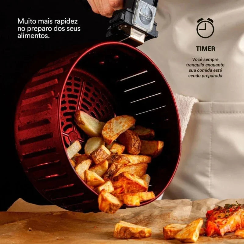 Fritadeira de ar chef gourmet 4,2 litros com cesto vermelho e batatas fritas sendo preparadas.
