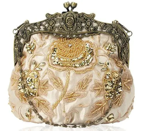Bolsa feminina vintage com design bordado floral em tons de rosa e dourado, ideal para eventos elegantes