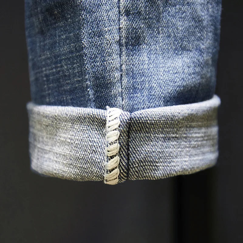 Calça masculina CASTUN jeans rasgado azul claro com barras dobradas para um visual moderno