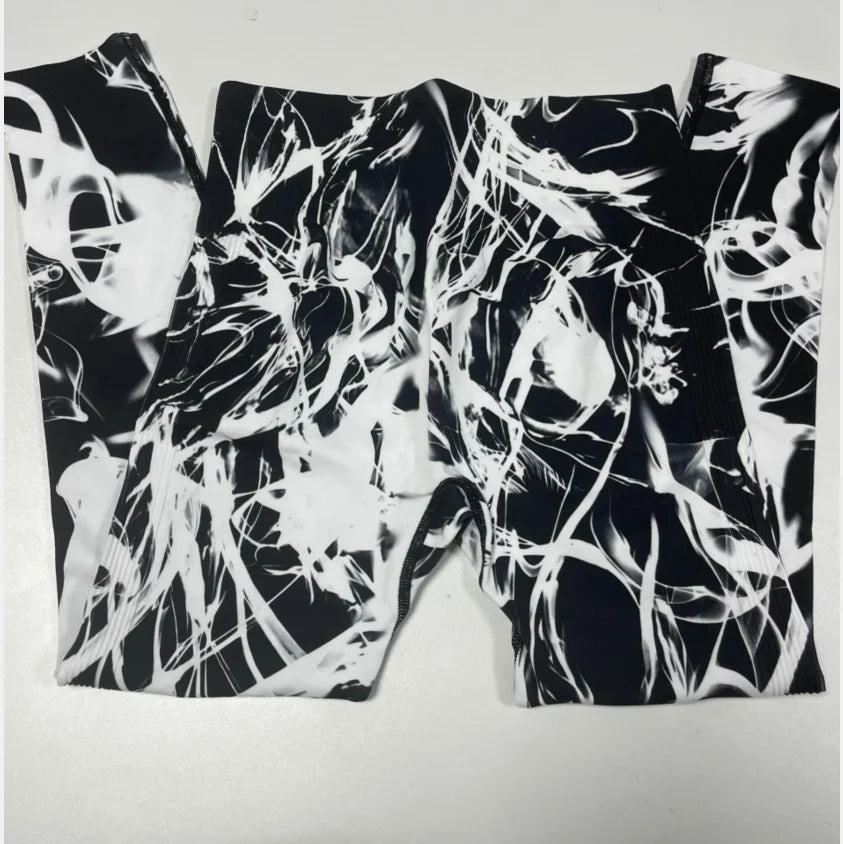 Calça feminina TIANKA legging cintura alta sem costura com estampa abstrata em preto e branco
