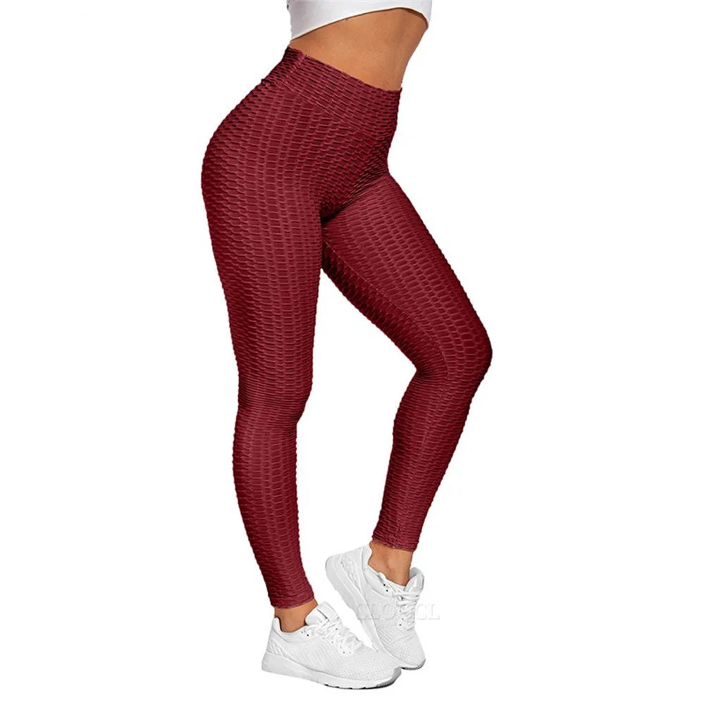 Calça feminina legging push up treino em tom vermelho, ideal para atividades físicas e conforto.