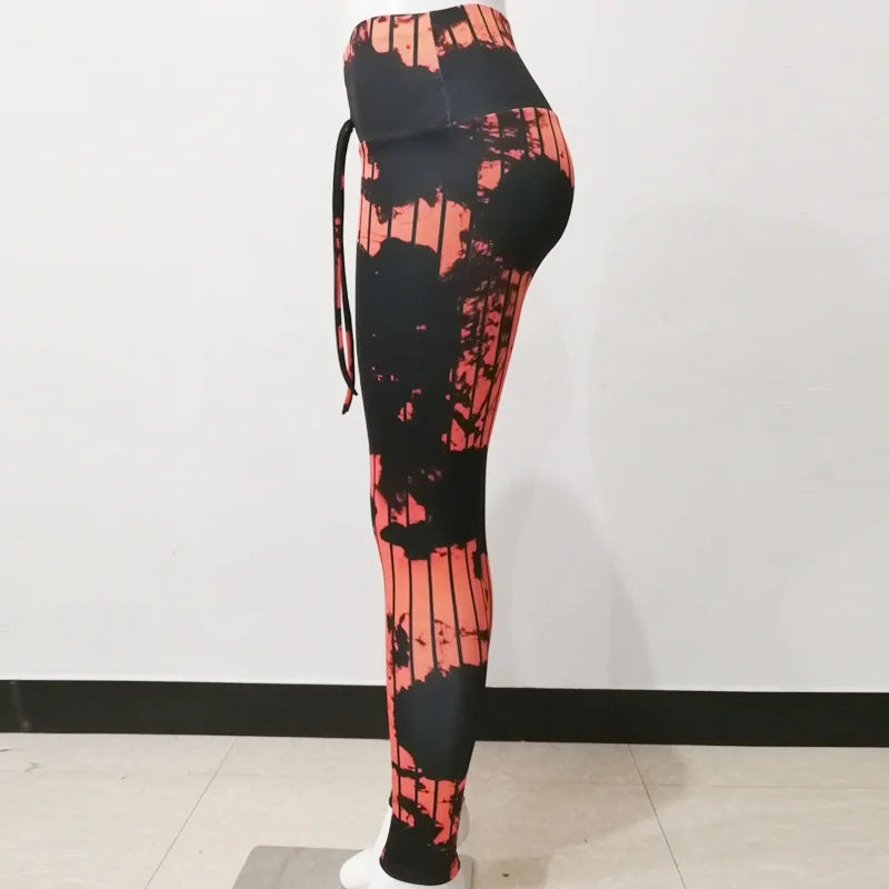 Leggings para ioga coloridas com estampa preta e laranja, confortáveis e ajustáveis