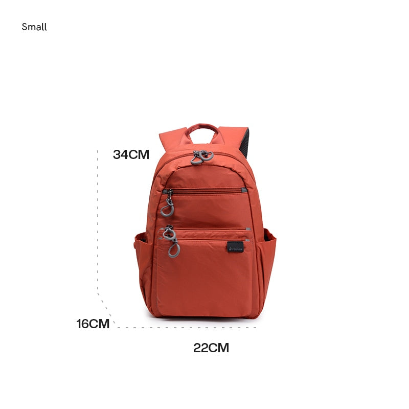 Mochila feminina casual grande da FOUVOR em laranja com múltiplos bolsos e medida de 34x22x16 cm