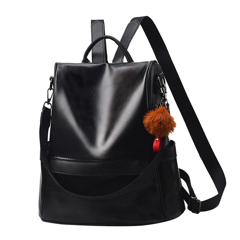 Mochila feminina de couro PU preta com pompom decorativo e alças ajustáveis para uso diário