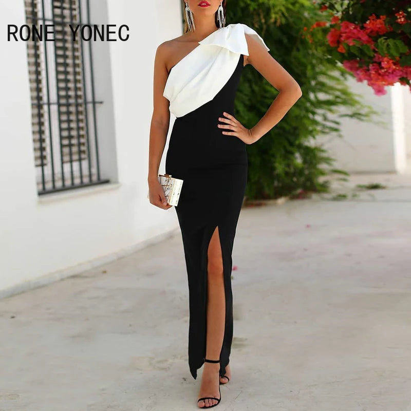 Vestido formal feminino preto e branco com detalhe assimétrico e fenda elegante para eventos especiais