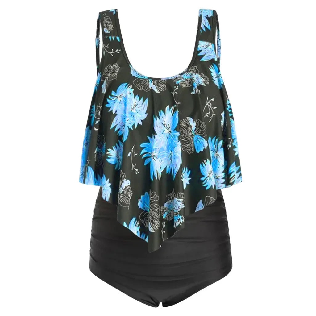 Maiô feminino plus size com estampa floral azul e preto, ideal para a praia como roupa de banho feminina plus size