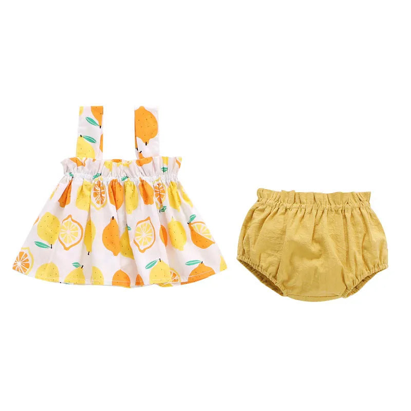 Conjunto de roupas infantis estampadas da LAWADKA com vestido amarelo de limões e fraldinha combinando