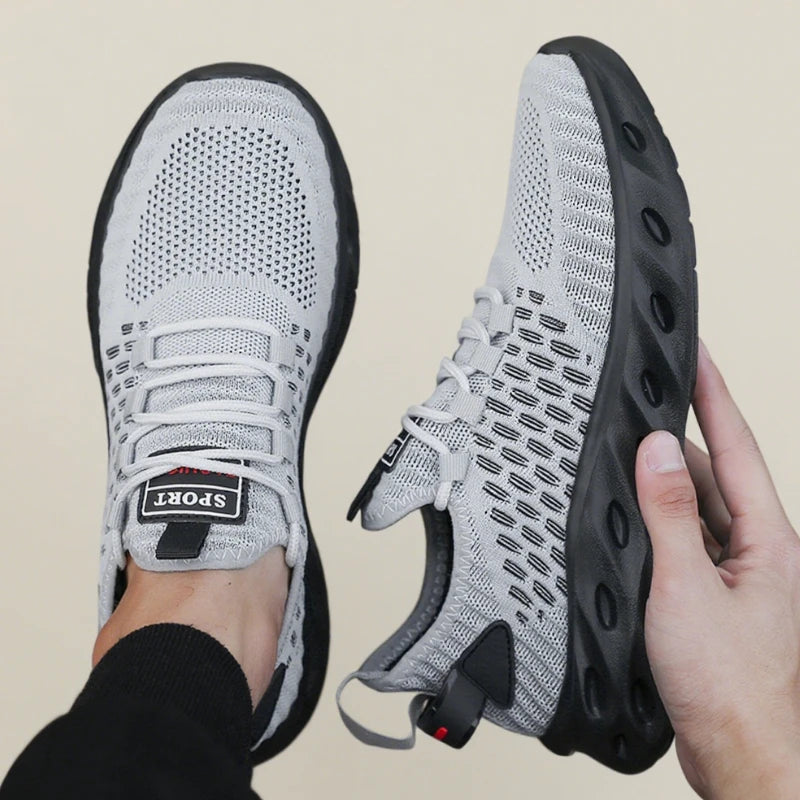 Tênis masculino DQTBE em cinza com design respirável, ideal para esportes em 2025.