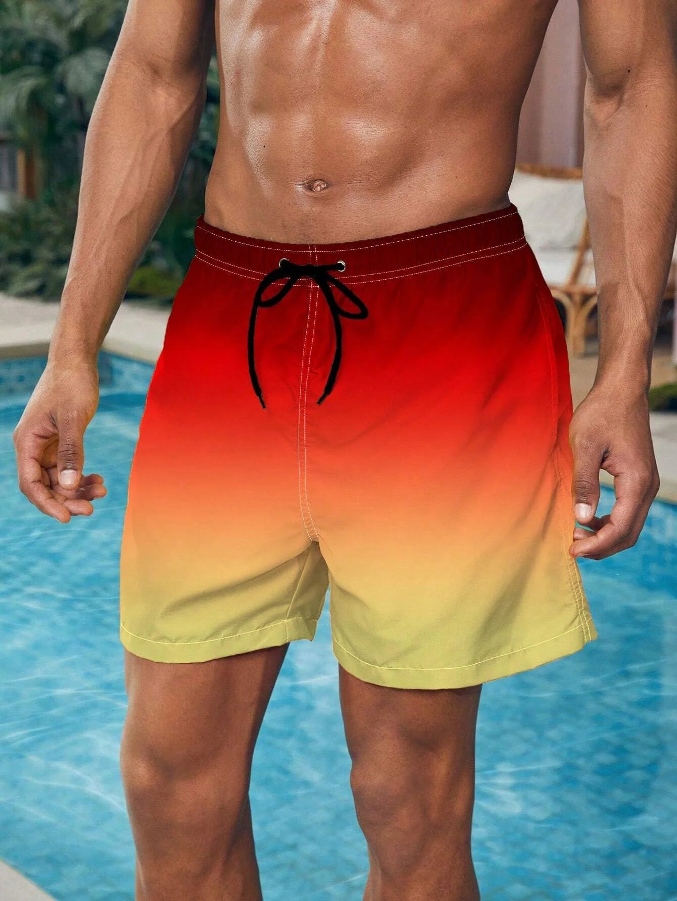 Shorts de banho masculino com efeito degradê vermelho e amarelo, perfeitos para um dia na piscina