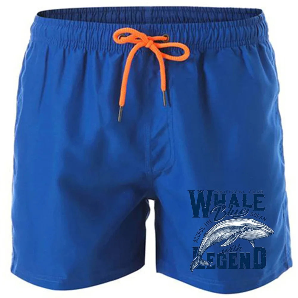 Shorts estampados de baleia em azul com cordinha laranja e estampa de lenda marinha