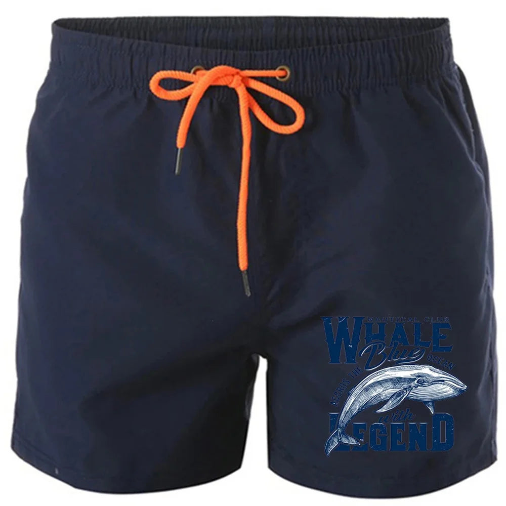 Shorts estampados de baleia em azul marinho com cordão laranja e estampa de baleia