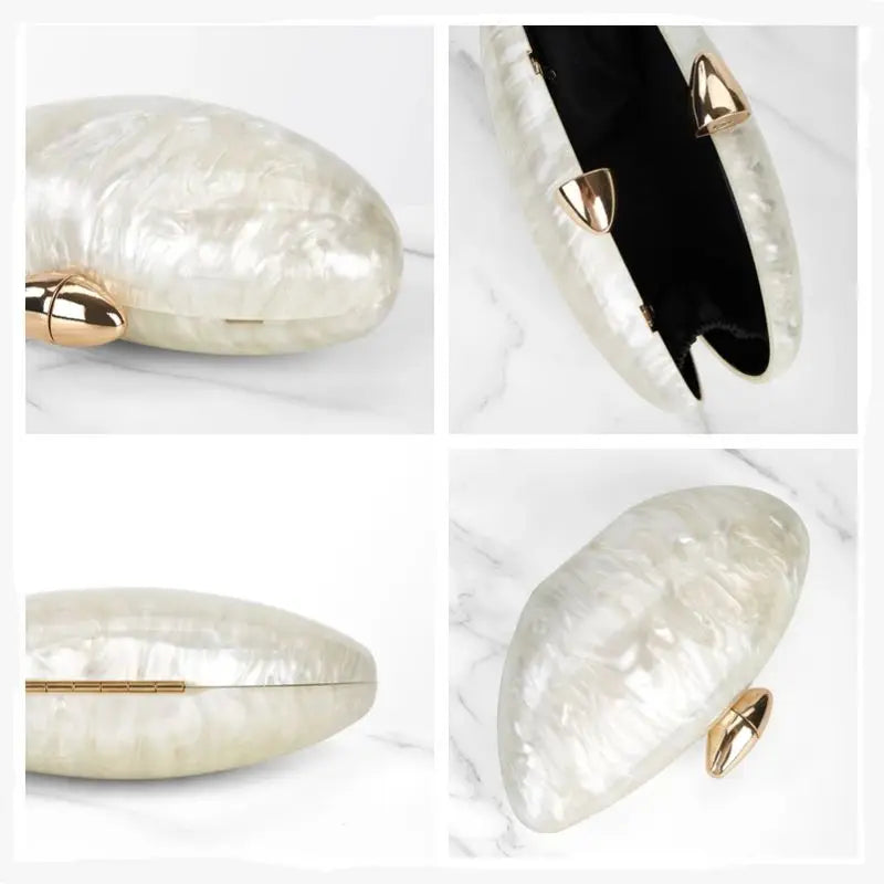Bolsa designer ovo marfim com acabamento brilhante e detalhes em dourado, ideal para ocasiões especiais.