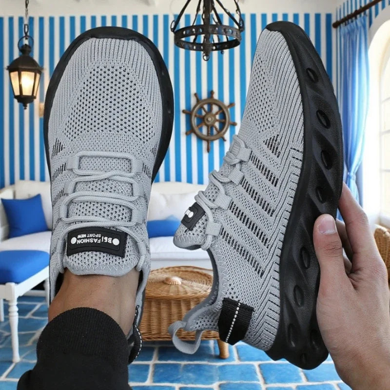 Tênis esportivo masculino absorção de impacto em cinza com design leve e respirável para conforto durante atividades físicas