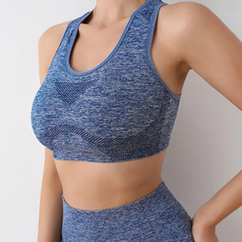 Terno feminino fitness azul com ajuste confortável, ideal para práticas de ioga e atividades físicas.