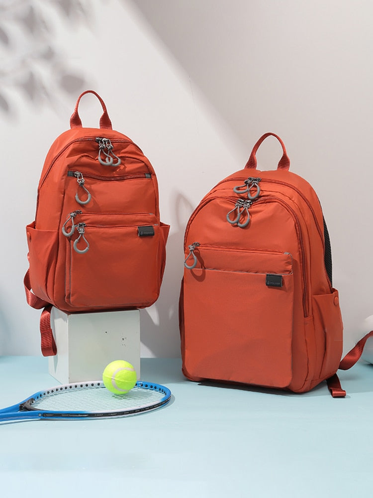 Mochila feminina casual grande da FOUVOR em laranja com múltiplos bolsos e design funcional