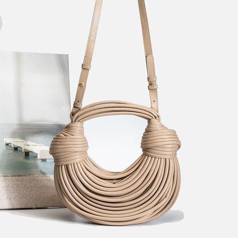 Bolsa feminina de festa da Weixier em tom neutro com design moderno e puxadores torcidos