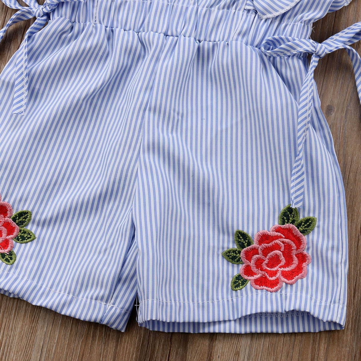 Macacão feminino infantil FAITHTUR com listras azuis e bordados de flores coloridas